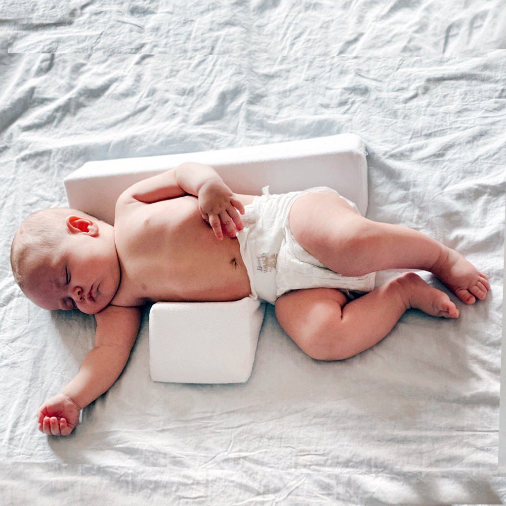 Pillow to keep baby from rolling over best sale